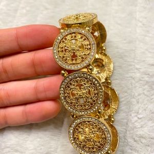 Fancy gold, stretchy bracelet, never worn!